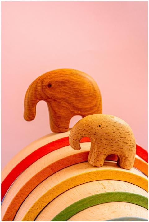 A still life of wooden elephant figurines displaye