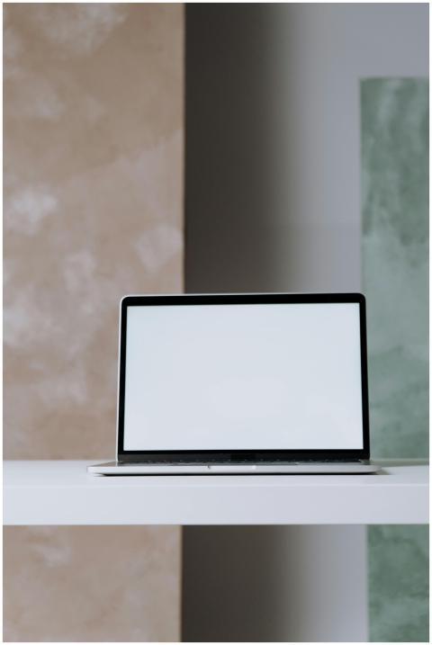 Mockup of a modern laptop on a minimalist desk, pe