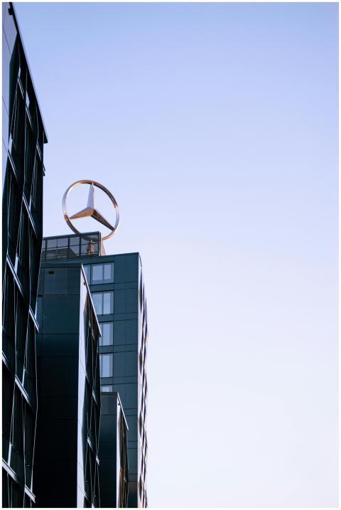 Low angle view of a modern building topped with a