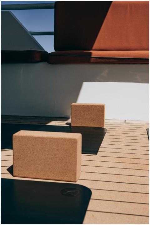 An outdoor yoga space with cork blocks and mats on