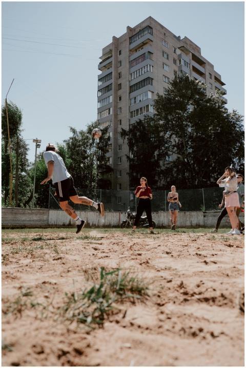 Friends play a spirited game of soccer on a sunny