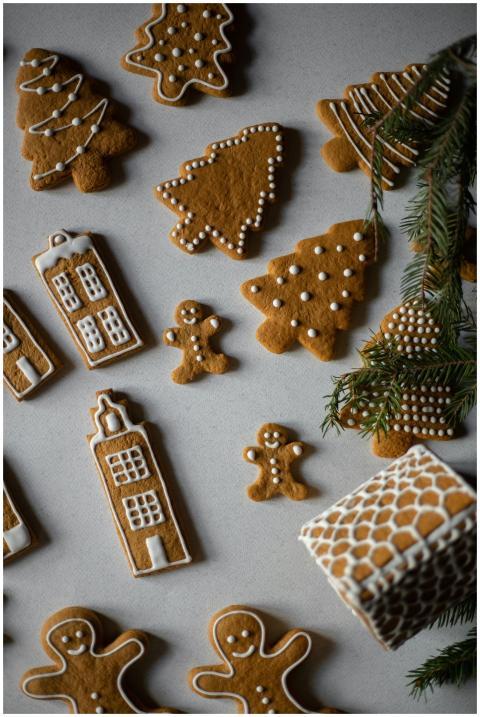 Flat lay of homemade gingerbread cookies with fest