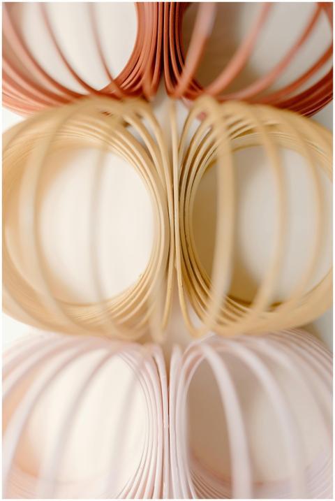 Stylized photo of pastel slinkies arranged in a ge