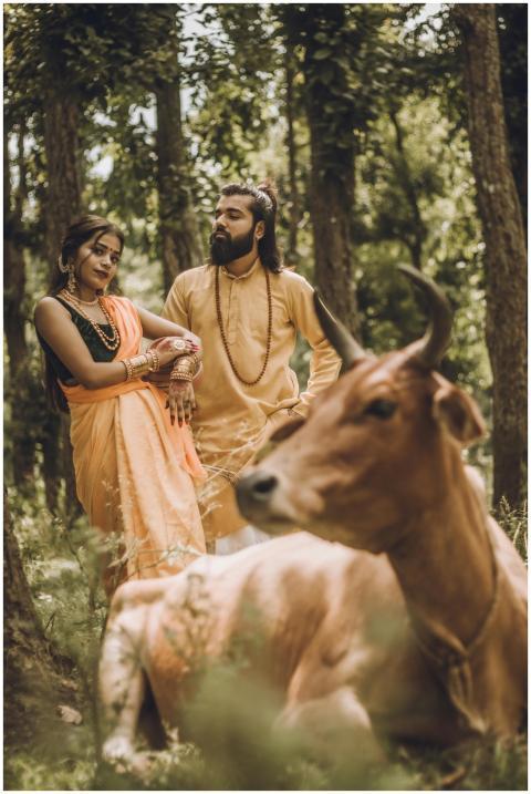 Elegant Indian couple in traditional attire with c
