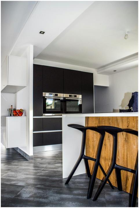 A contemporary kitchen featuring sleek cabinetry a