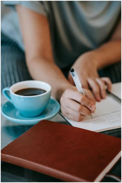 High angle of crop unrecognizable female author ta