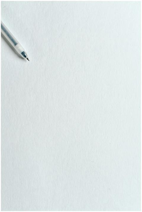 A clean minimalist image featuring a pen on blank