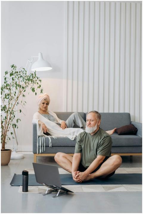 Senior couple practicing yoga and relaxing on the