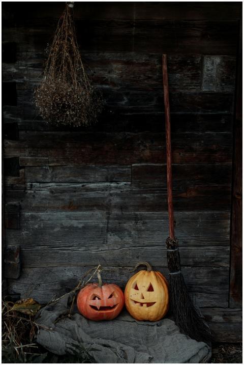 A creepy Halloween scene with carved pumpkins and