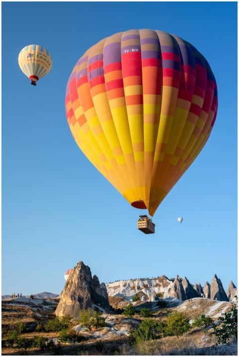Vibrant hot air balloons soaring over Cappadocia's