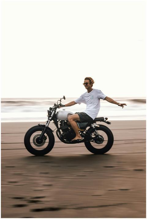 Young man enjoying a carefree motorcycle ride on a