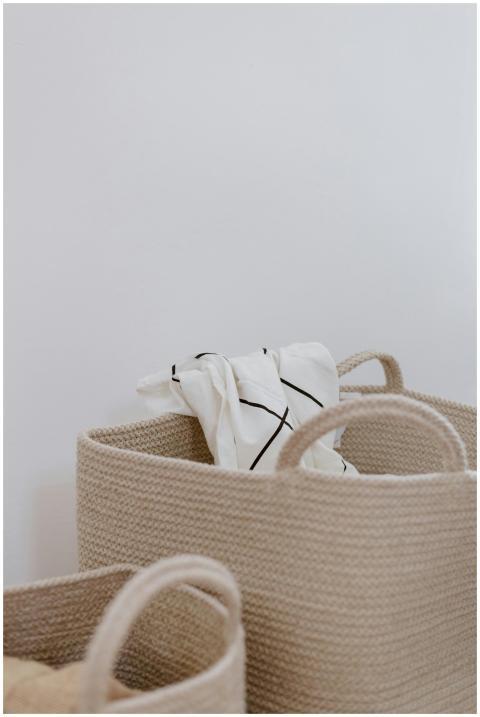 Cozy storage baskets with rolled linens, perfect f