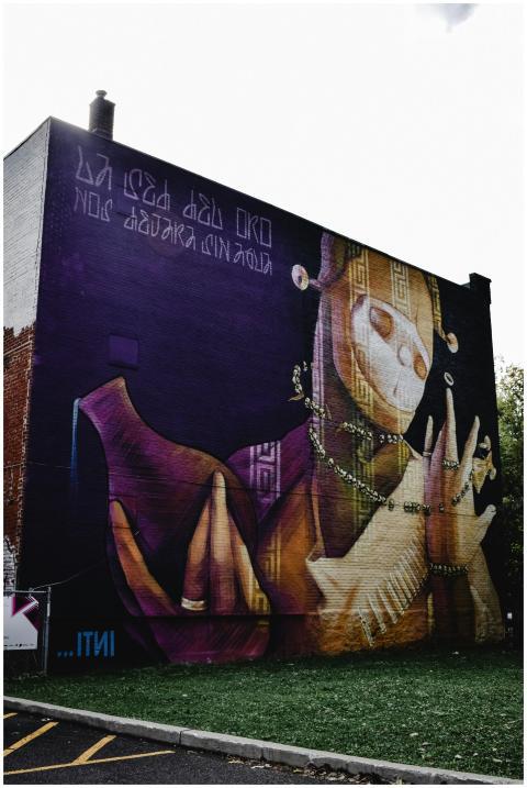 Explore a colorful urban mural in Montreal showcas