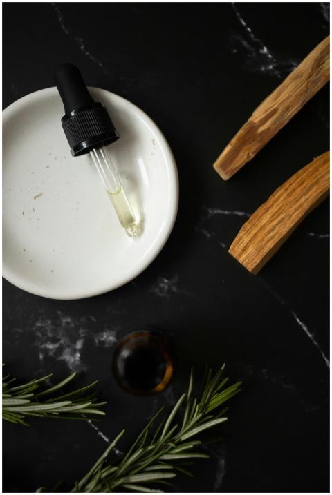 Top view of white clean plate with aromatic oil co