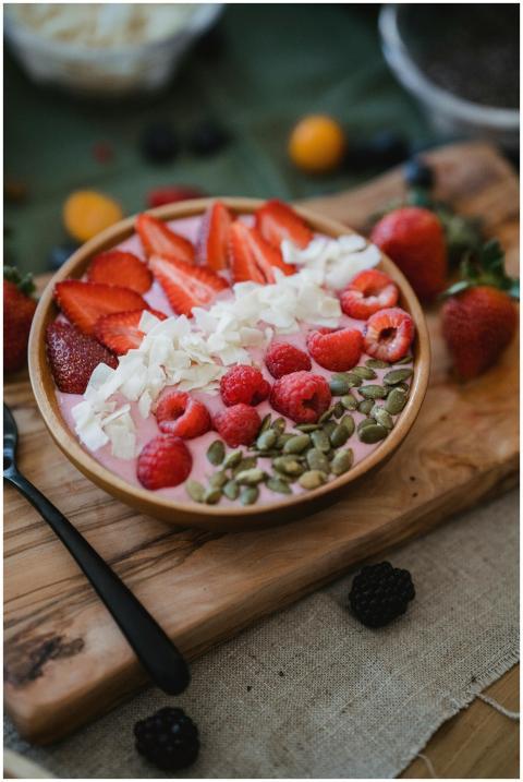 Delicious berry smoothie bowl with fresh strawberr