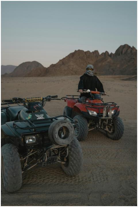Vibrant action shot of ATV rider exploring vast de
