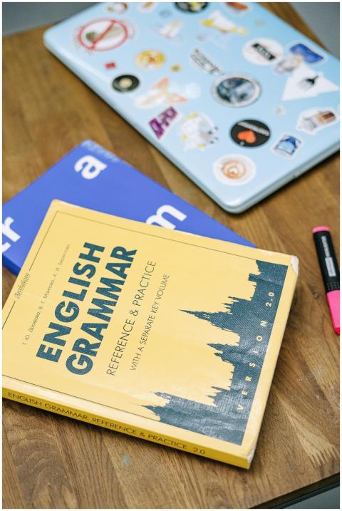 High-angle view of an English grammar book and a l