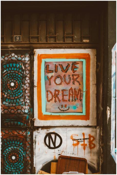 A colorful graffiti art with the message 'Live You