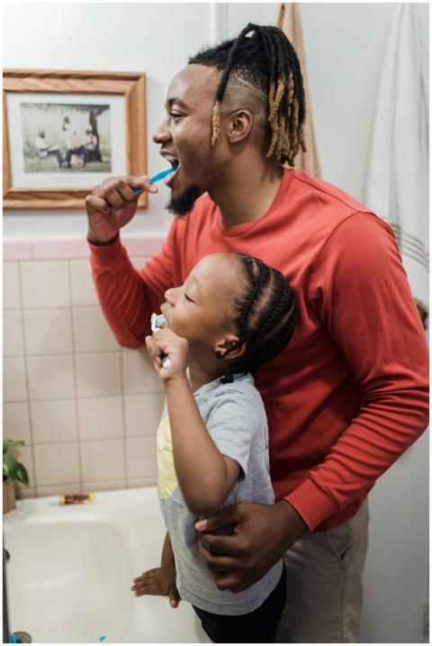 Father and daughter enjoying a morning teeth brush