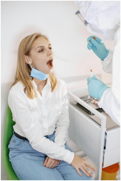 Healthcare worker conducts a swab test on a patien