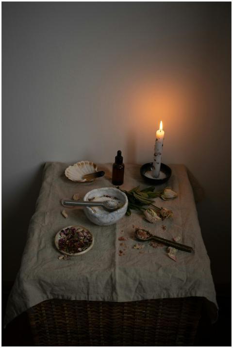 Warm, intimate scene of a candlelit table with her