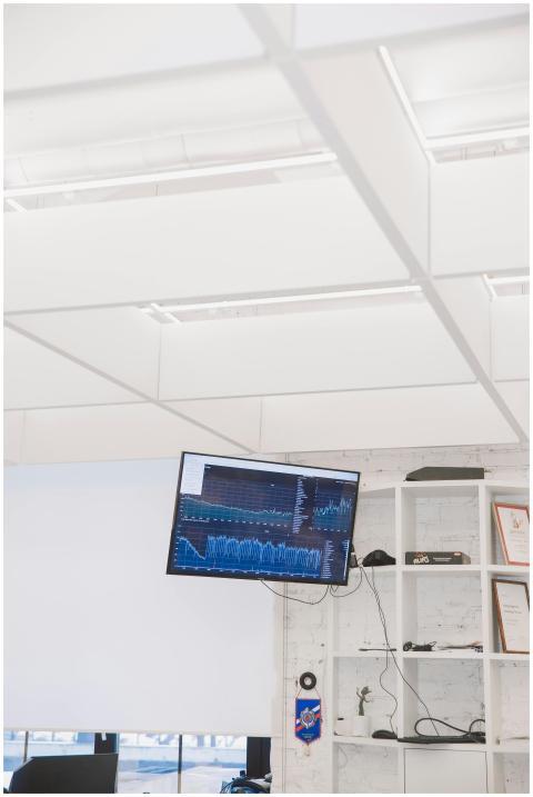 A contemporary office setup featuring a wall-mount
