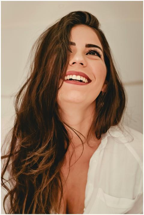 Portrait of a happy woman with long brunette hair