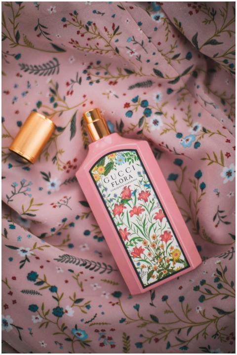 Elegant Gucci Flora perfume bottle on floral patte