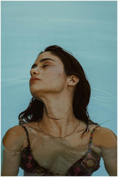 Portrait of a woman in a bikini floating calmly in