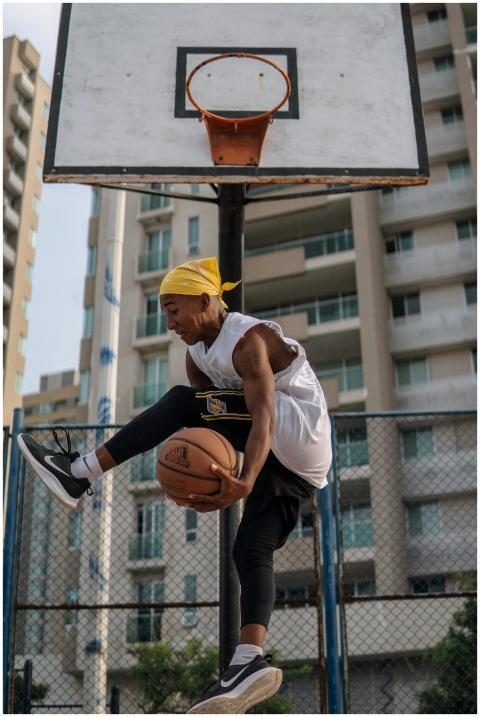 Young man in mid-air performing a basketball trick