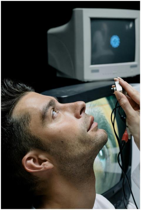 A man participating in a technological eye examina