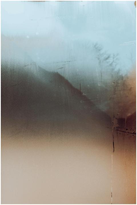 Misty and abstract view through a blurred glass wi