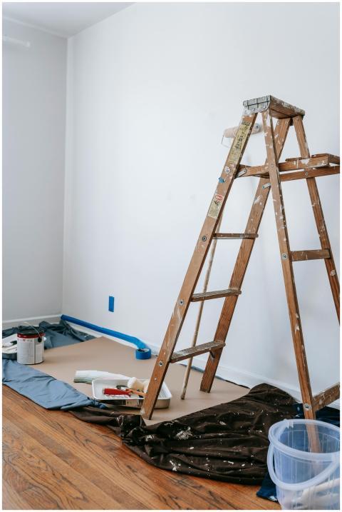 A home renovation scene featuring a wooden ladder,
