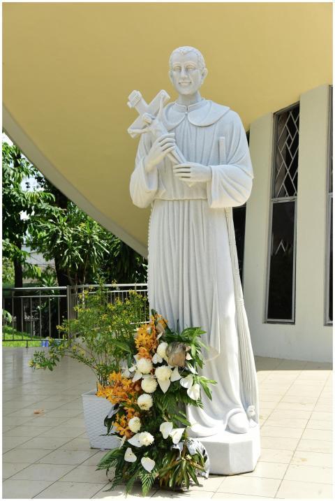 Outdoor statue of a religious figure with vibrant