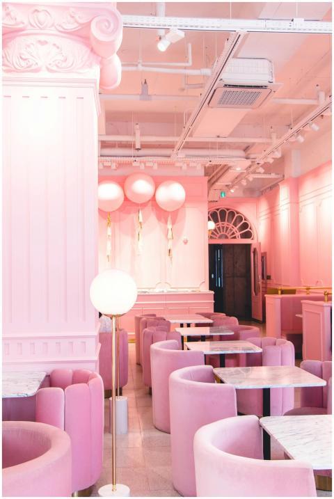 Stylish pink café interior featuring modern design