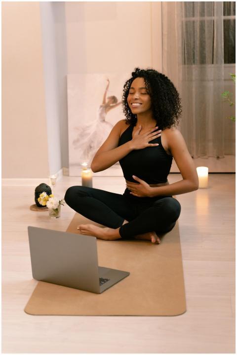 African American woman practicing yoga and meditat