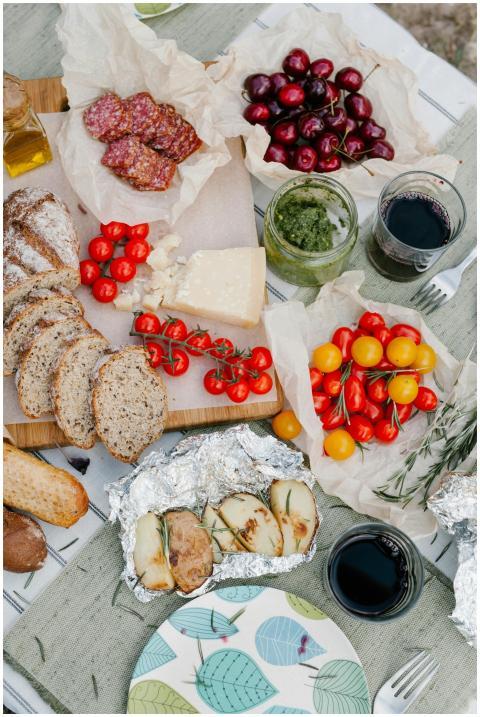 Delightful Italian picnic with bread, cheese, toma