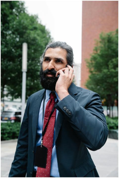 Confident businessman in formal attire conversing