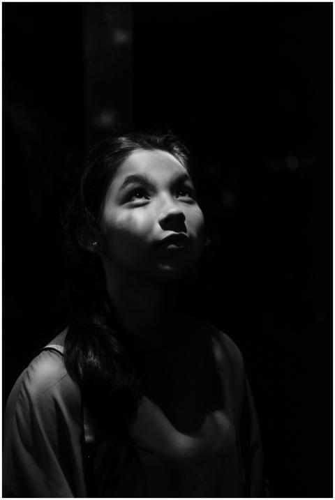 Artistic black and white photograph of a woman gaz