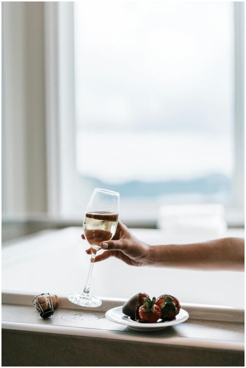 A relaxing indoor setting featuring a wine glass a