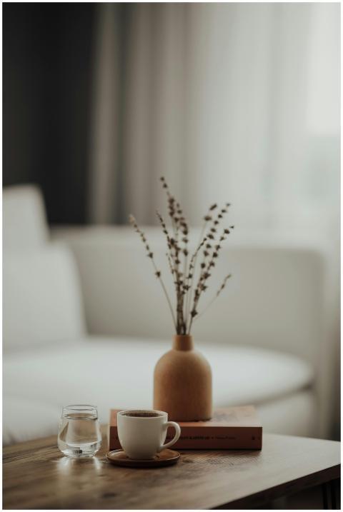 Warm minimalist home interior with a coffee cup, b