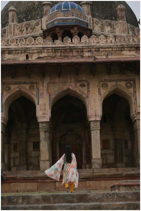 Back view of a woman standing before the ancient T