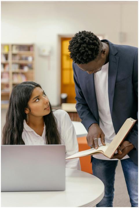 Young adults engaging in a focused study session w