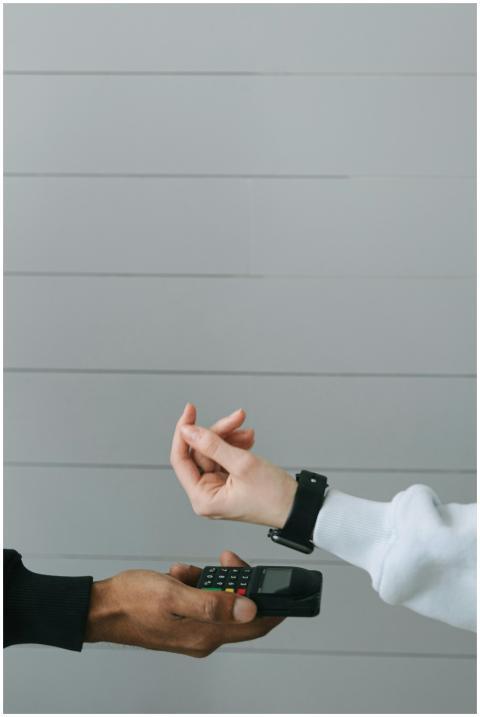 Close-up of a smartwatch being used for a contactl