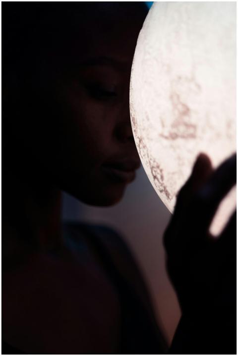 A serene and mysterious silhouette of a woman tend