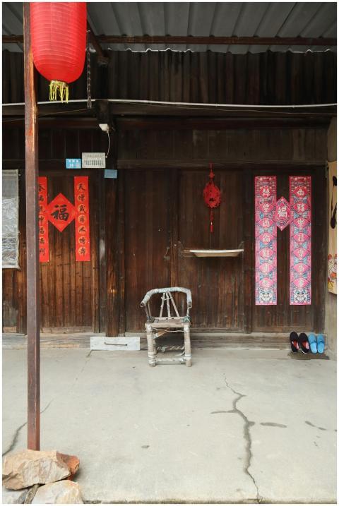 Rustic entrance with red lanterns and traditional