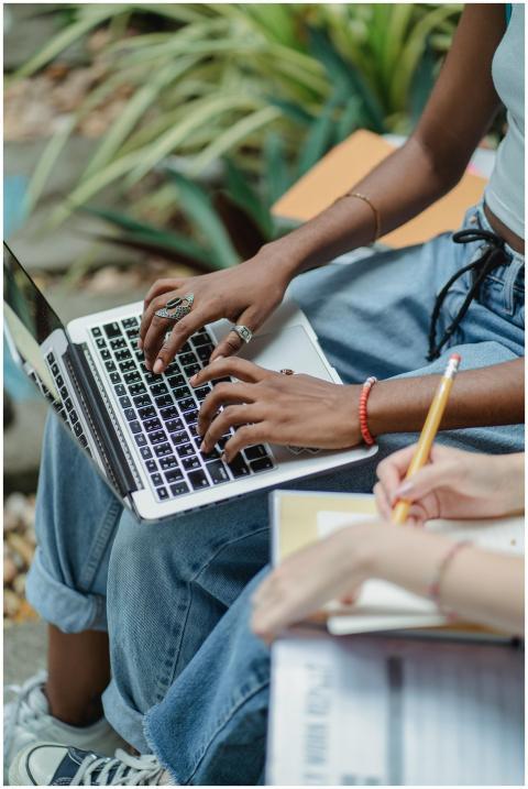 High angle crop faceless young multiracial women s