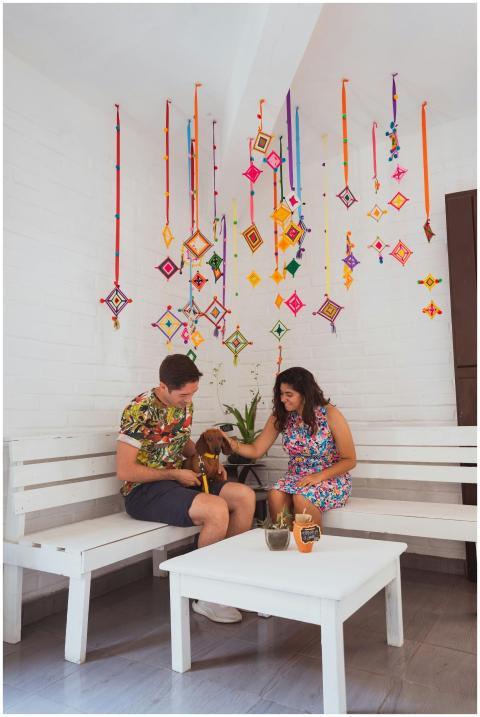 A couple enjoys a cozy moment with their dog in a