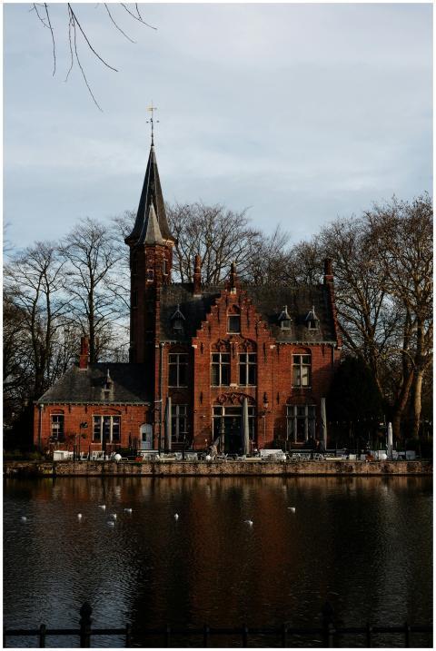 Scenic view of a Gothic building reflected in a ca