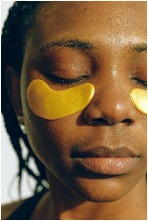 Crop gentle African American female with closed ey